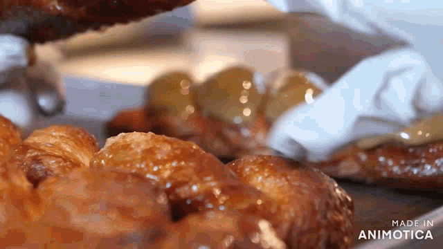 a close up of a bunch of food with the words made in animatica on the bottom right