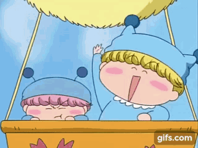 a couple of children are sitting in a hot air balloon .