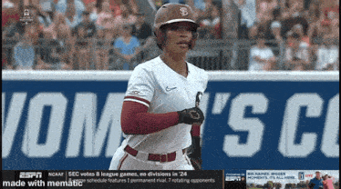 a baseball player is running in front of a sign that says ' sec votes 8 league games '