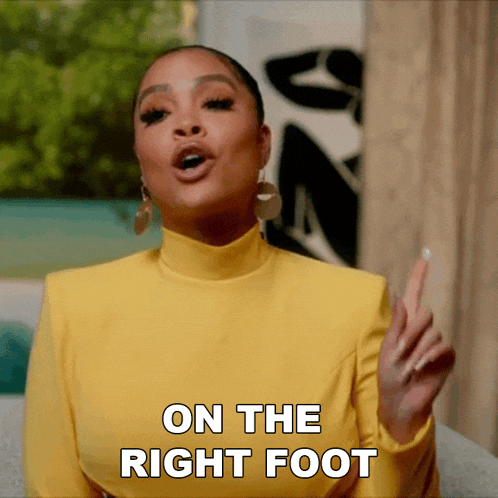 a woman in a yellow top says " on the right foot " with her finger