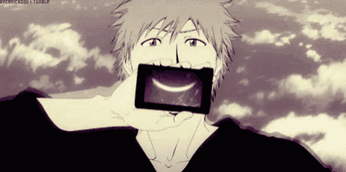 a man is holding a cell phone in his mouth with a smile on it
