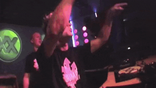 a man wearing a shirt that says jump is dancing