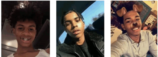 three young men are posing for a selfie in a car .