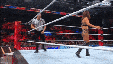 a woman in a wrestling ring with the words fox sports 2 on the screen