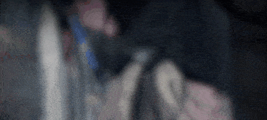a blurry image of a person holding a gun