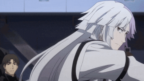 a man with long white hair is standing in front of a staircase