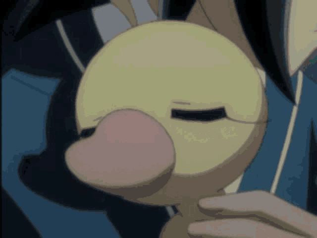 a person holding a stuffed duck with a pink beak