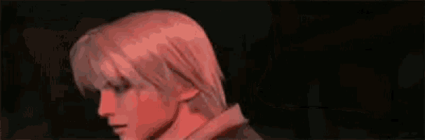 a close up of a woman 's face in a video game with red eyes .