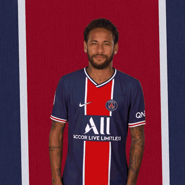 a soccer player wearing a jersey that says all accor live limitless