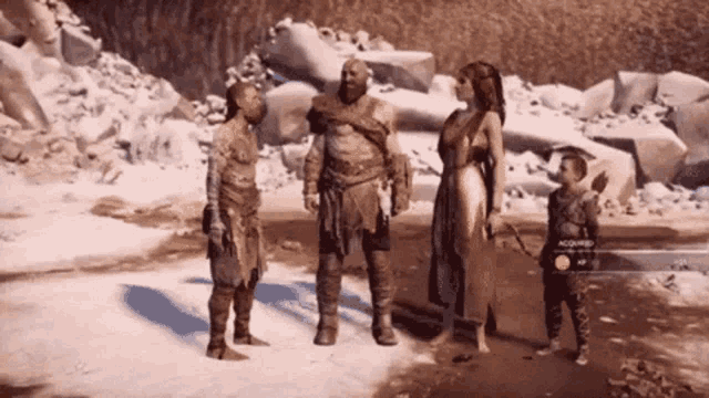 a group of people standing next to each other on a snowy beach .