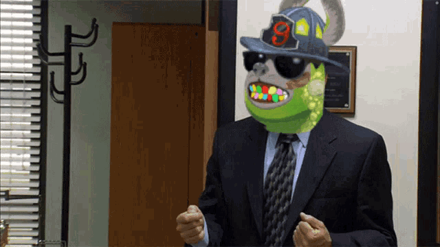 a man in a suit and tie is wearing a fireman 's hat and sunglasses with the number 9 on it