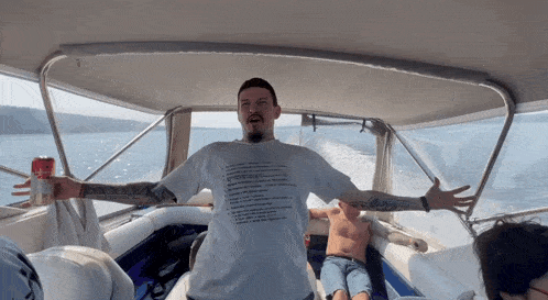 a man on a boat wearing a t-shirt that says ' a few rules '