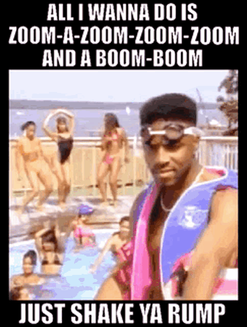 a man in a life jacket is standing in front of a pool with a group of women dancing in the background .