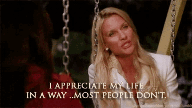 a woman sitting on a swing with the words i appreciate my life in a way most people don 't