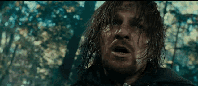 a man with long hair and a beard is standing in the woods with his mouth open