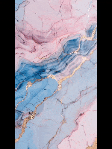 a close up of a pink and blue marble pattern