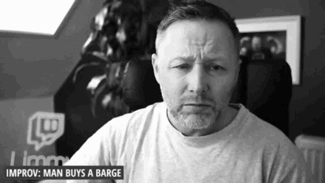 a black and white photo of a man with the words improv man buys a barge above him