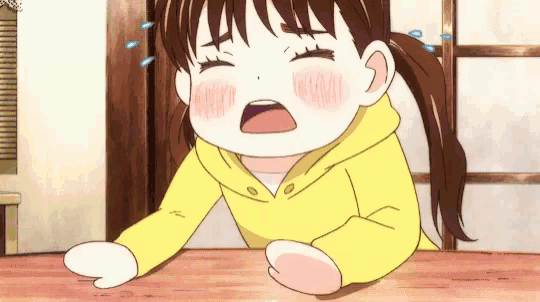 a cartoon girl in a yellow hoodie is crying with her eyes closed