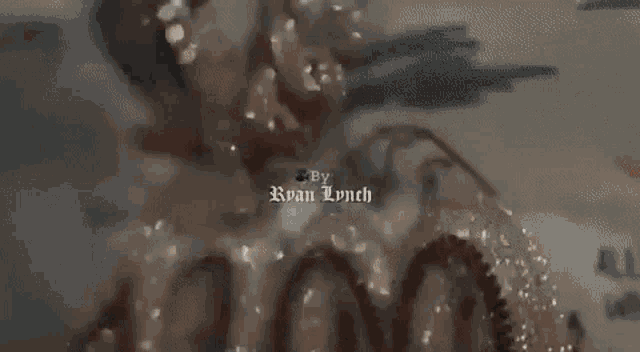 a man with dreadlocks wearing a hat and a necklace is dancing in a dark room .