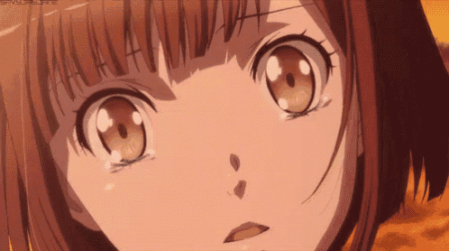 a close up of a girl 's face with a tear running down her cheek