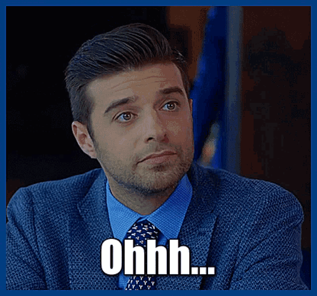 a man in a suit and tie is making a funny face with the word ohhh above him