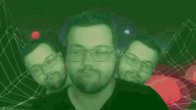 a man with glasses and a beard is surrounded by other men 's faces .