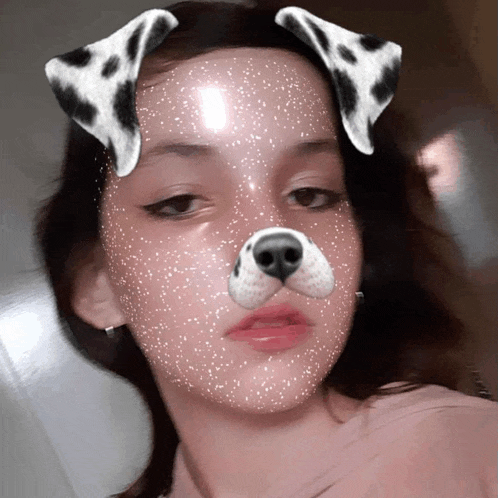 a girl with a dalmatian face mask on her face