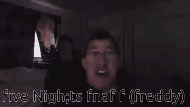 a close up of a man 's face with glasses and the words `` five nights at freddy '' written on it .