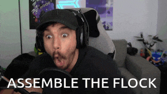 a man wearing headphones and a hat says " assemble the flock " in front of him