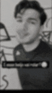 a blurry picture of a man 's face with the words " i love you " on the bottom right