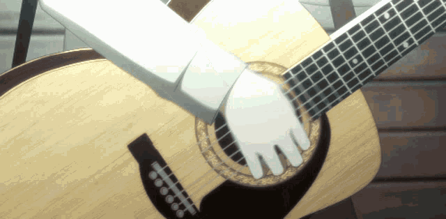 a person playing an acoustic guitar with a sword in their hand