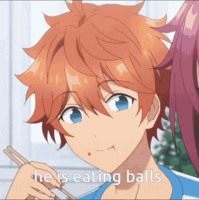 a boy is eating balls with chopsticks in his mouth