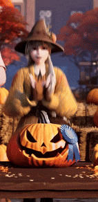a girl in a witch hat is standing next to a pumpkin with a blue ribbon on it .
