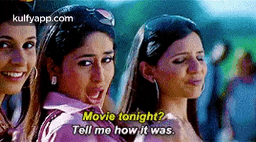 a group of women are standing next to each other and one of them is asking another woman to tell her how it was .