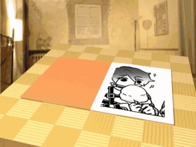 a piece of paper with a picture of a person on it is on a table