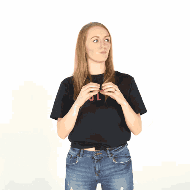 a woman wearing a black t-shirt that says bl