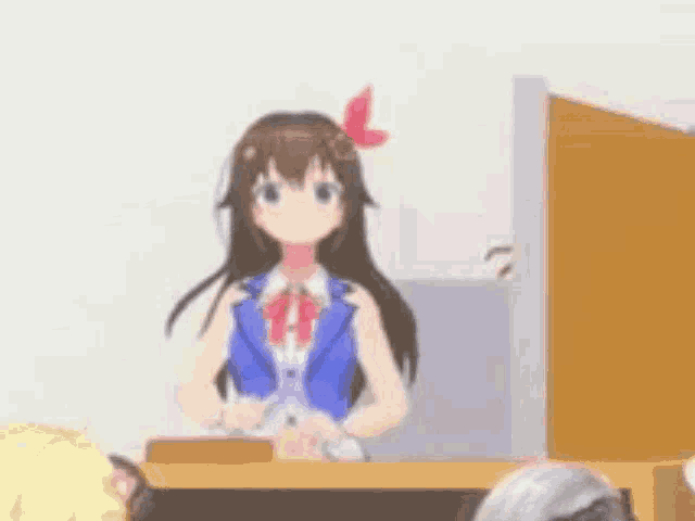a girl in a blue jacket is standing in front of a group of people .