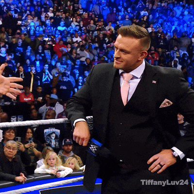 a man in a suit and tie is standing in front of a crowd with tiffanyluv24 written on the bottom