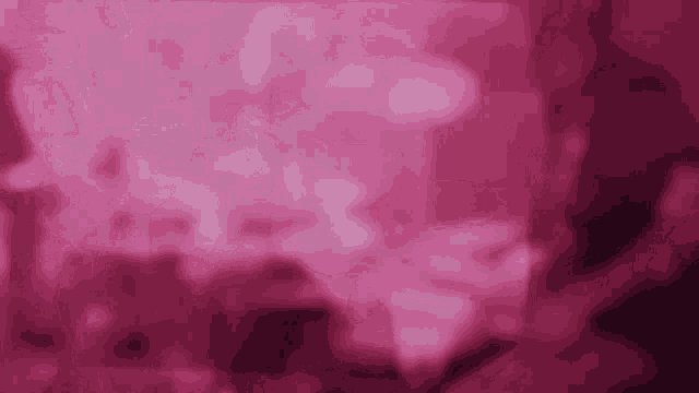 a pink background with a blurred image of a person playing a guitar .