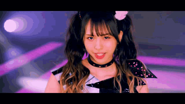 a girl with pigtails is wearing a choker and a cat headband .
