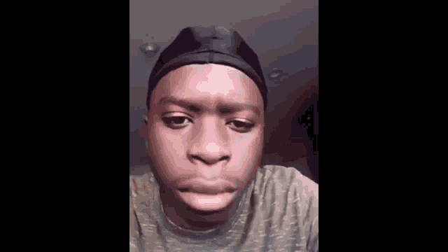 a close up of a man 's face with his eyes closed .
