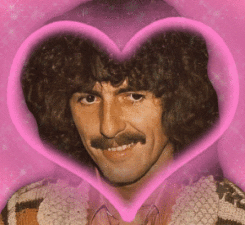 a man with a mustache is in a pink heart