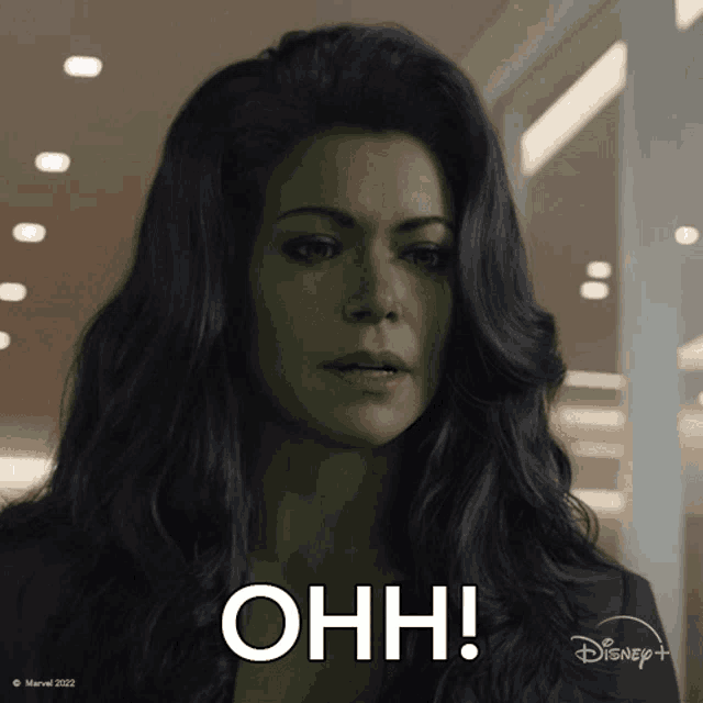 a woman with green hair says ohh on a disney+ ad