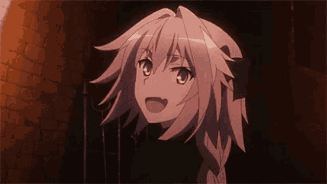 a girl with white hair is standing in a dark room with a brick wall in the background .
