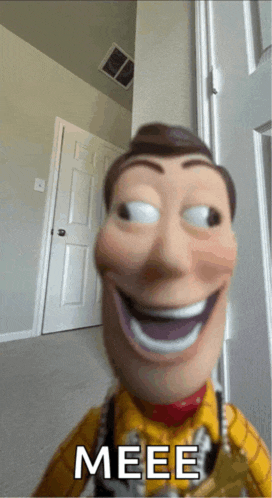 a woody doll is smiling and says meee on the bottom right