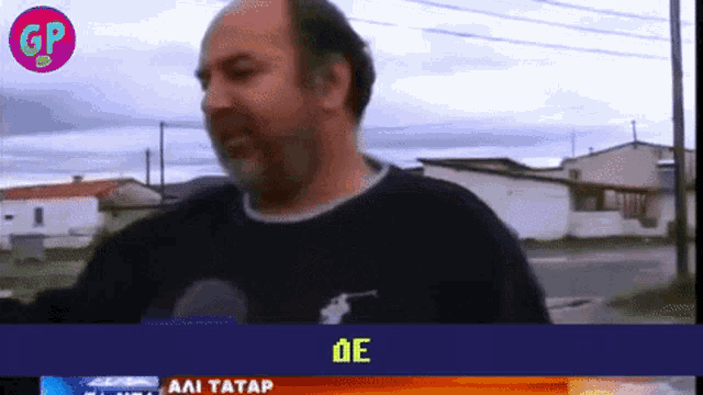 a man in a polo shirt is being interviewed on gp