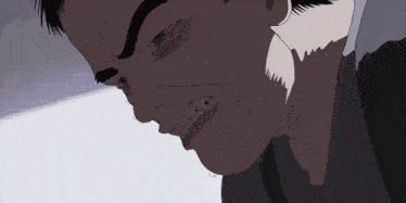 a close up of a man 's face with his mouth open and sweat coming out of his mouth .
