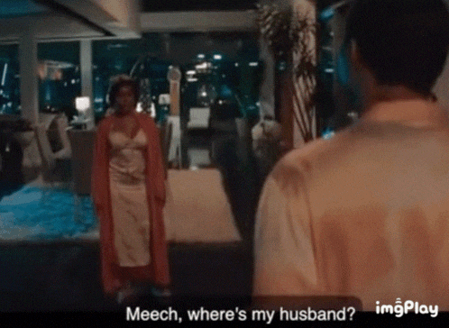 a man and a woman are standing in a room and the woman is asking the man where his husband is
