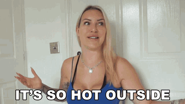 a woman says it 's so hot outside in front of a white door