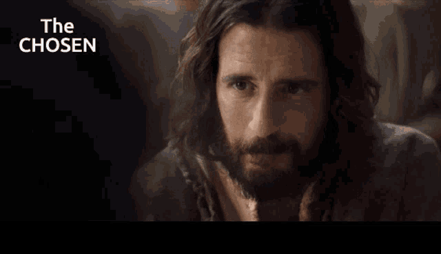 a man with long hair and a beard is shown with the words the chosen above him